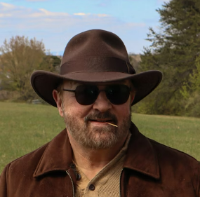 Man in brown hat and sunglasses